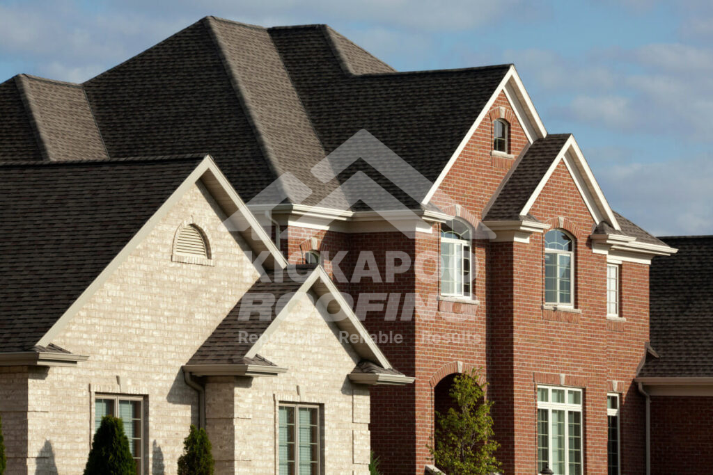 Red brick house with brown roof