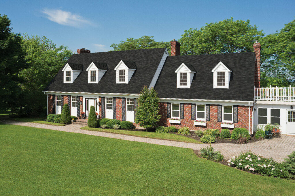 Red brick house  with black roof