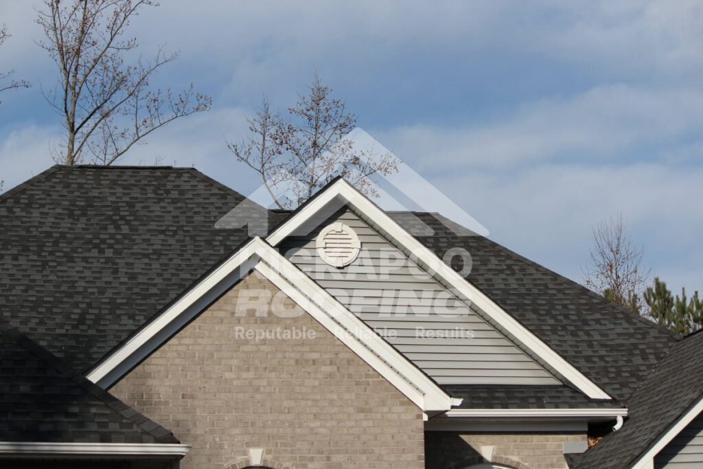 Gray siding with a black roof