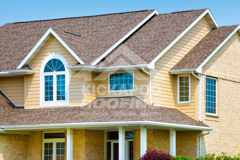 Sand yellow siding with a brown roof