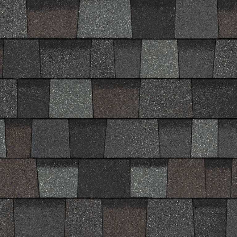 Dark textured asphalt roof shingles in various shades